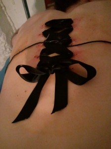 Ribbon sutured onto back